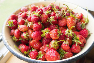 Plate with fresh natural berries appetizing strawberry close-up