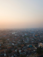 Fototapeta na wymiar Hazy morning sky over residential complex in Tangerang, Indonesia.