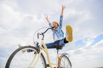 Cycling gives you feeling of freedom and independence. Girl rides bicycle sky background. Freedom...