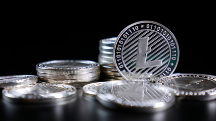 Litecoin Crypto Currency. Coins on a Dark Background