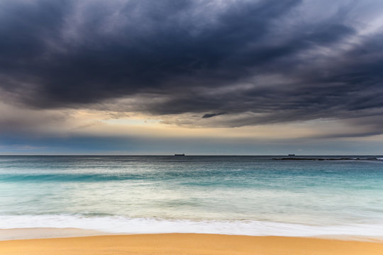 Early morning seascape with heavy clouds