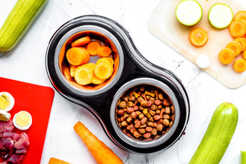 Set of animal food, meat,vegetables and eggs on kitchen top view