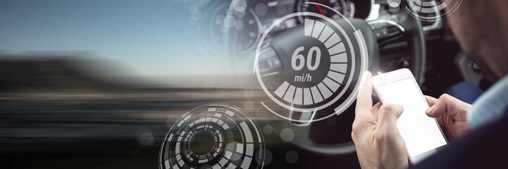 Man driving in car with heads up display interface and phone and