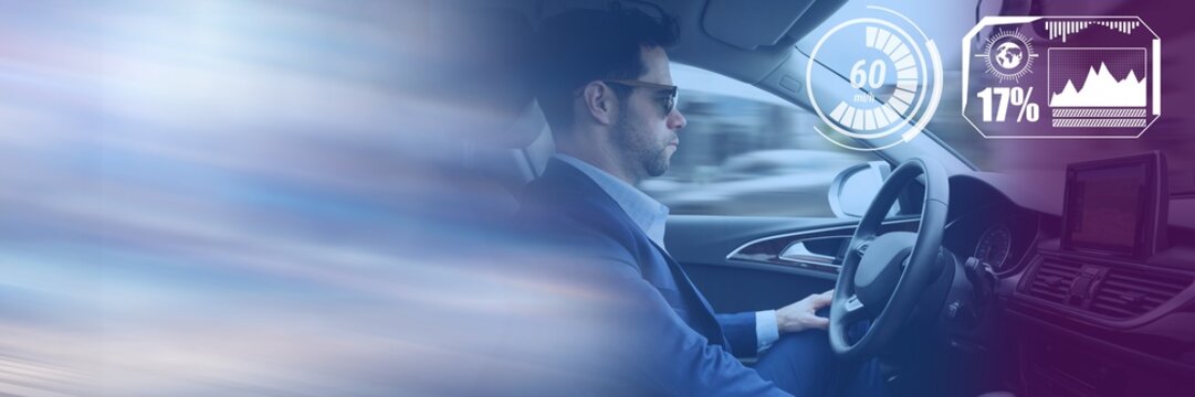 Man driving in car with heads up display interface and