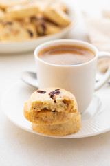 A cup of coffee with homemade cookies on a white background.