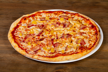 Pizza with bacon and pineapple