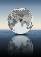 Pakistan on globe above water