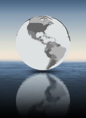 Costa Rica on globe above water