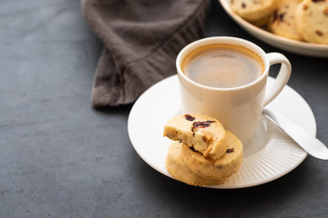 Closeup of cookies and a cup of coffee. Symbolic image. Concept for a tasty snack. Sweet dessert. Selective focus. Close up.