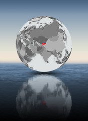 Kyrgyzstan on globe above water