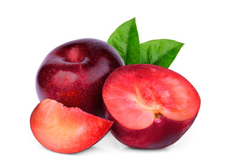 whole and slices red plum with green leaves isolated on white background
