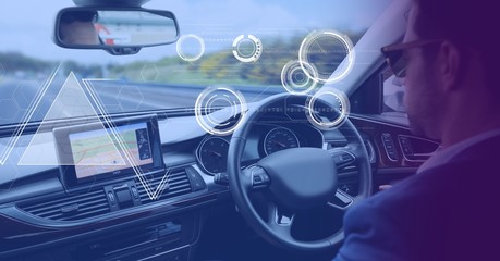 Man driving in car with heads up display interface