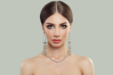 Elegant woman with jewelry portrait. Jewelry for woman, necklace and earrings with pearls. Beauty and accessories.