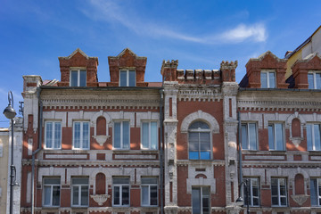 Urban landscape and architecture of the city against the blue sky.
