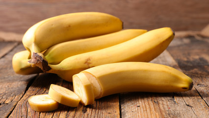 banana on wood background © M.studio