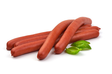 Hungarian smoked pork sausages with basil leaves, isolated on white background.