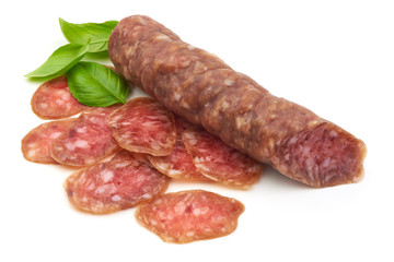 Smoked sausage with slices and green basil leaves, isolated on white background