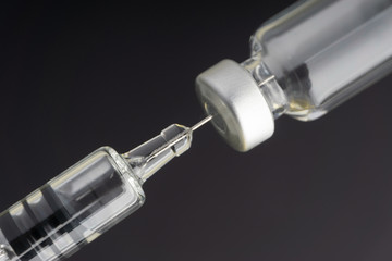 Syringe and vials closeup with selective focus and crop fragment. Medical and Healthcare Concept