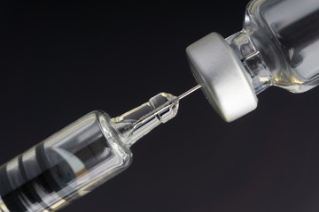 Syringe and vials closeup with selective focus and crop fragment. Medical and Healthcare Concept