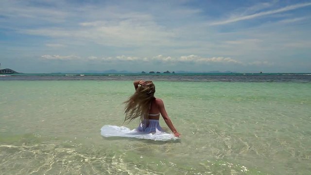 Young Caucasian Woman in White Skirt Bathing in Tropical Turquoise Sea