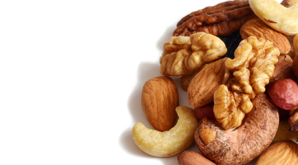 Several types of hazelnut cashew almonds on white background isolate