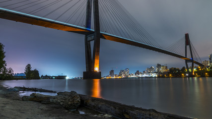 Patullo Bridge, Surrey, British Columbia, Canada. Long exposure of the bridge over the water. Sky Train Bridge.