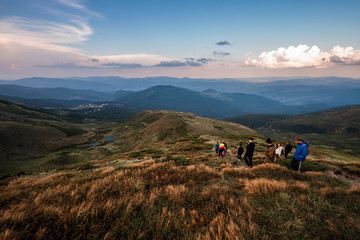 Obraz premium Group of hikers walking on a mountain. Carpathains, Ukraine
