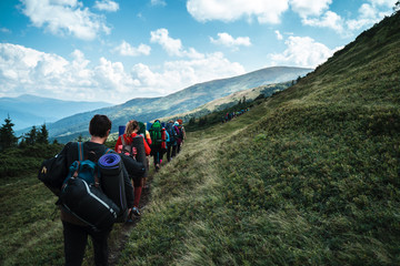 Group of hikers walking on a mountain. Carpathains, Ukraine