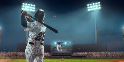 Fototapeta Baseball player bat the ball on professional baseball stadium obraz