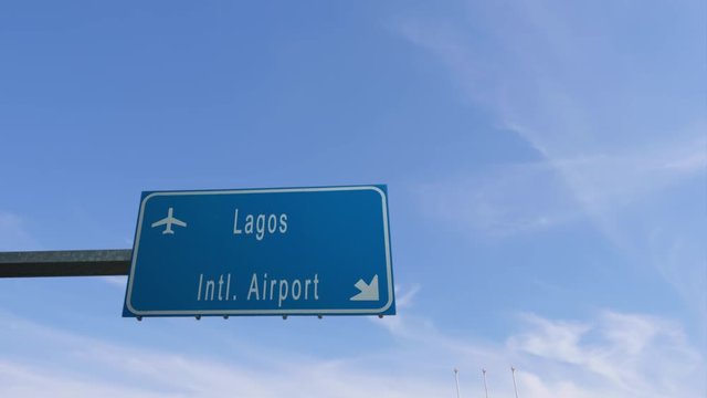 lagos airport sign airplane passing overhead