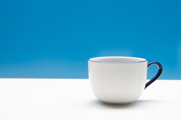 Cup of coffee with blue background