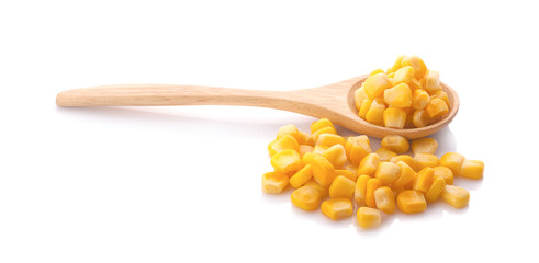 sweet corn in wooden bowl and spoon isolated on white background