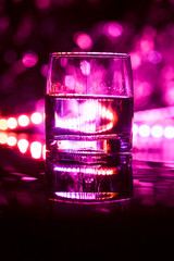 colored lighting of glasses in the night club bar