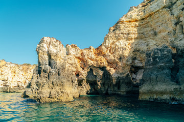 Rocks, Cliffs And Ocean Landscape At Lagos Bay Coast In Algarve, Portugal