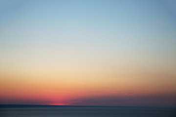 Naklejka na ściany i meble Seacost on a sunset. Beautiful landscape of the ocean