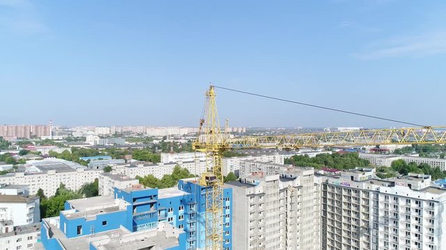 Lifting construction crane, aerial view.
