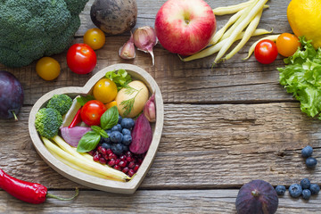 Healthy food in heart diet cooking concept with fresh fruits and vegetables
