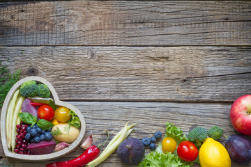 Healthy food in heart diet cooking concept with fresh fruits and vegetables
