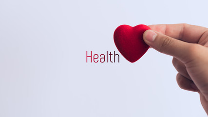 Red heart in hand, the concept of medicine or love