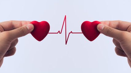 Red heart in hand, the concept of medicine or love