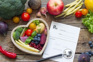 Healthy food in heart stethoscope and medical prescription diet and medicine concept
 - obrazy, fototapety, plakaty