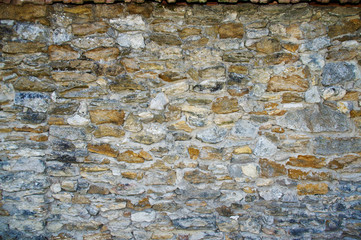 Texture of an old stone wall. Closeup