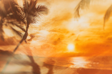Retro style background on which there is sunset on the beach with palm trees. It's beautiful...