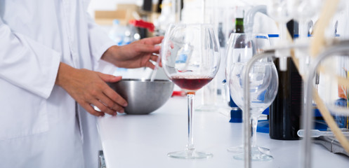 modern laboratory of winery. Checking acidity of wine and organoleptic characteristics