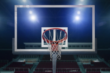 Naklejka premium Glass basketball board and hoop in an arena