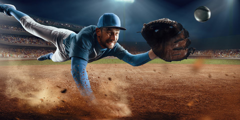 Baseball shortstop catches the ball on professional baseball stadium - obrazy, fototapety, plakaty