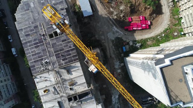 City, building crane, aerial view. Construction crane.