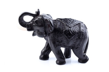 Fototapeta premium Black Engraved pattern elephant made of resin like wooden carving with white ivory. Stand on white background, Isolated, Art Model Thai Crafts, For decoration Like in the spa.