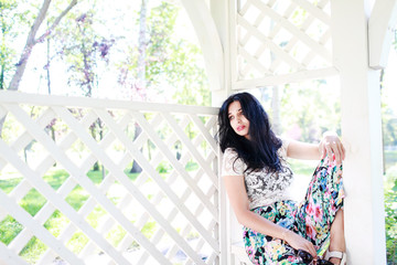 Fototapeta premium beautiful young women near a fence