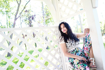 beautiful young women near a fence